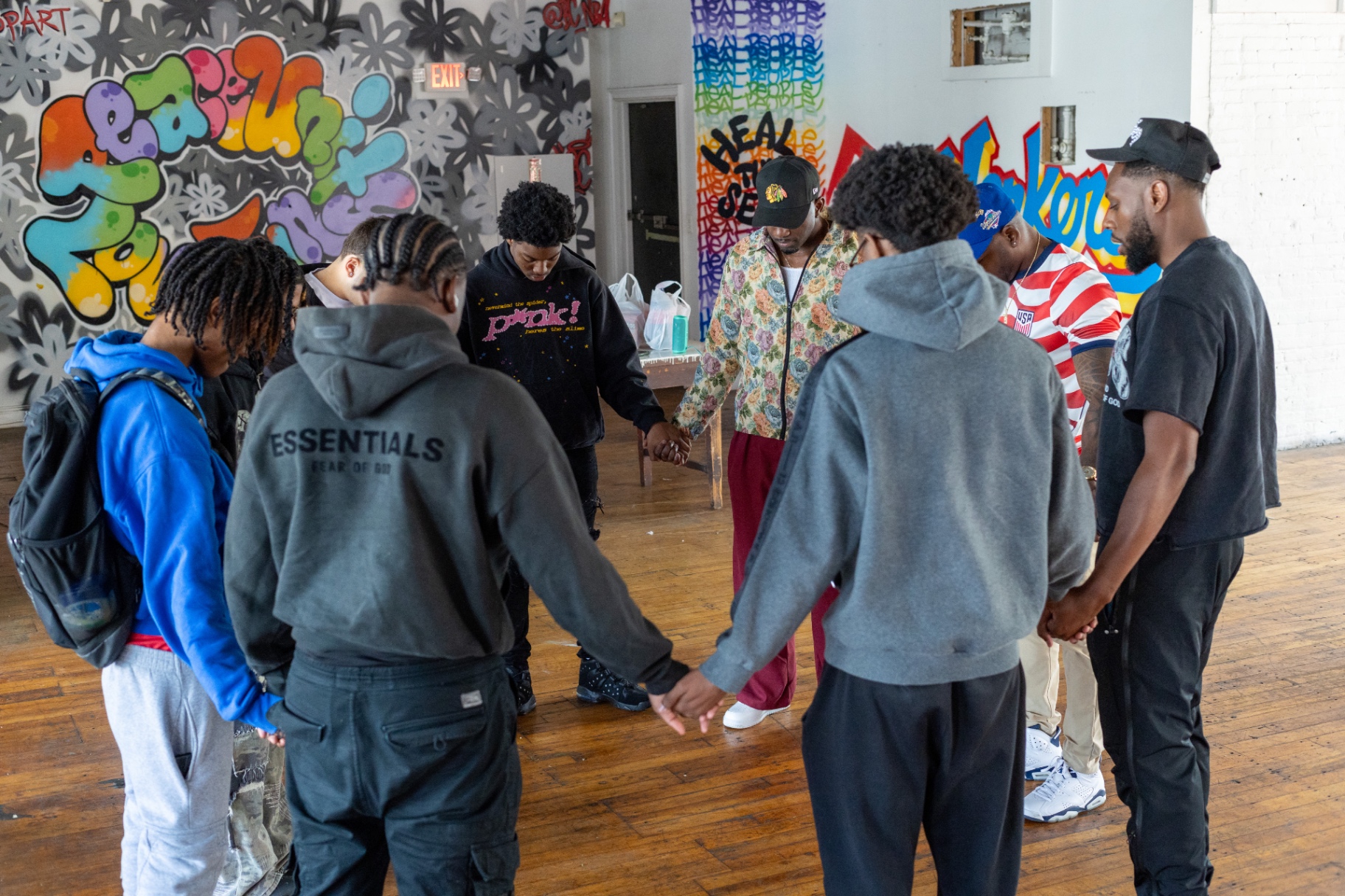 Young men in a prayer circle